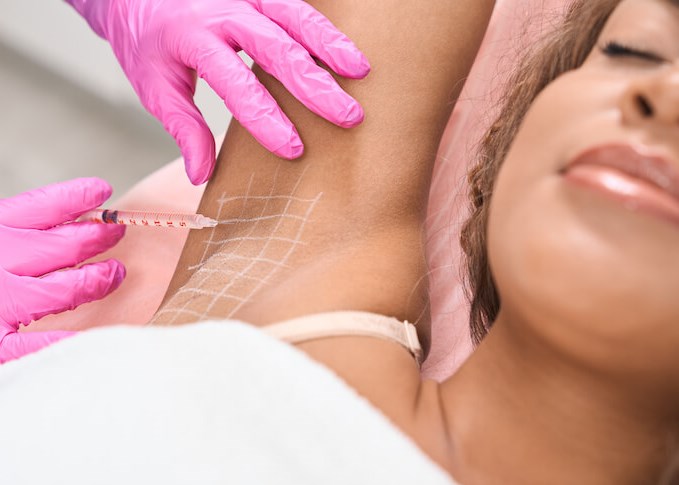 Hands in pink gloves performin